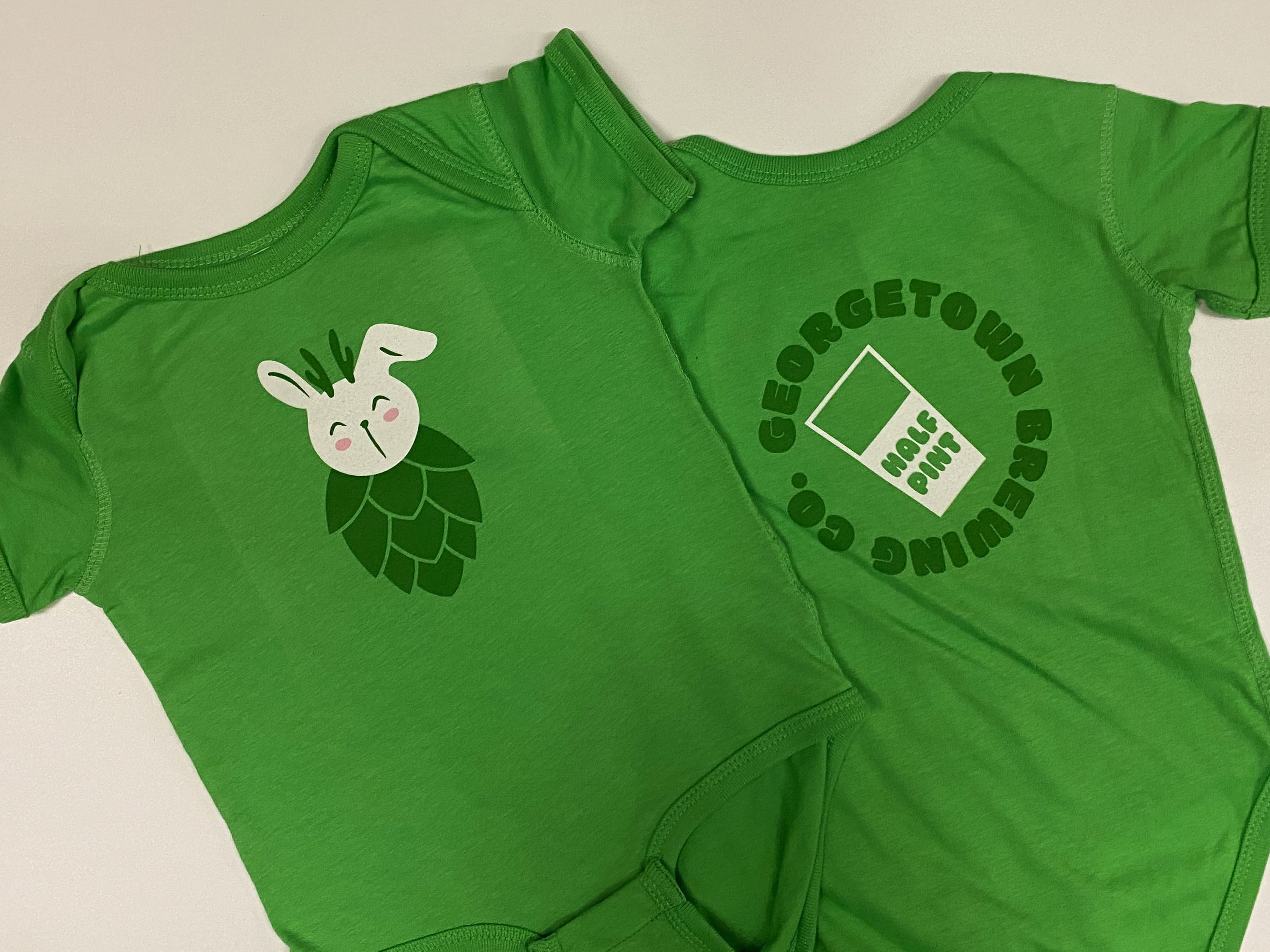 Green baby onesie with a bunny and hop design on the front and 'Georgetown Brewing Co.' logo on the back.