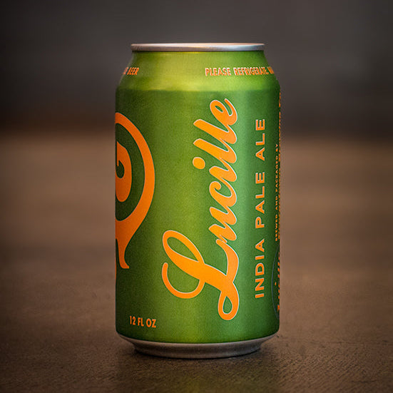 Can of Lucille IPA beer by Georgetown Brewing on the cement floor of the tasting room