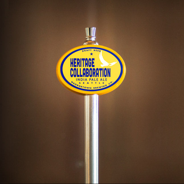 Heritage Collaboration India Pale Ale tap handle against a brown background