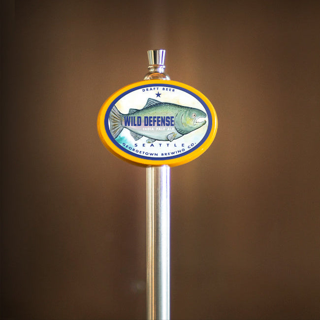 tap handle with 'Wild Defense' label on a brown background
