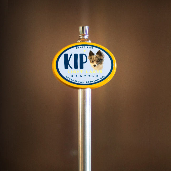 beer tap handle with KIP logo on a brown background