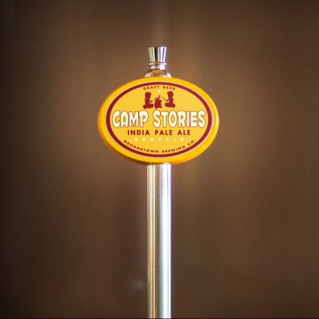 yellow oval tap handle with Camp Stories tap label