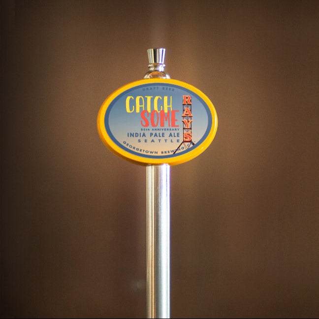 yellow oval tap handle with catch some rays tap label
