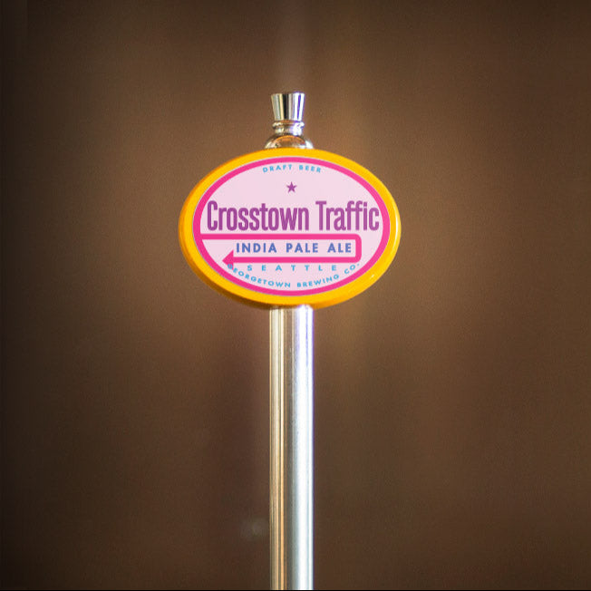 Crosstown Traffic India Pale Ale tap handle against a brown background