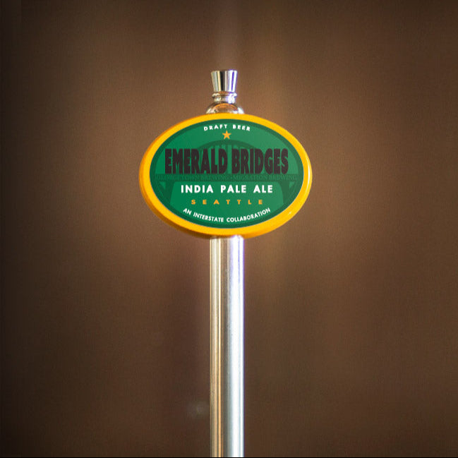 yellow oval tap handle with Emerald Bridges tap label
