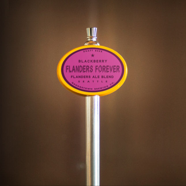 Beer tap handle with 'Blackberry Flanders Forever' label on a blurred background