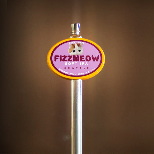 Fizzmeow Soft IPA beer tap handle on a brown background