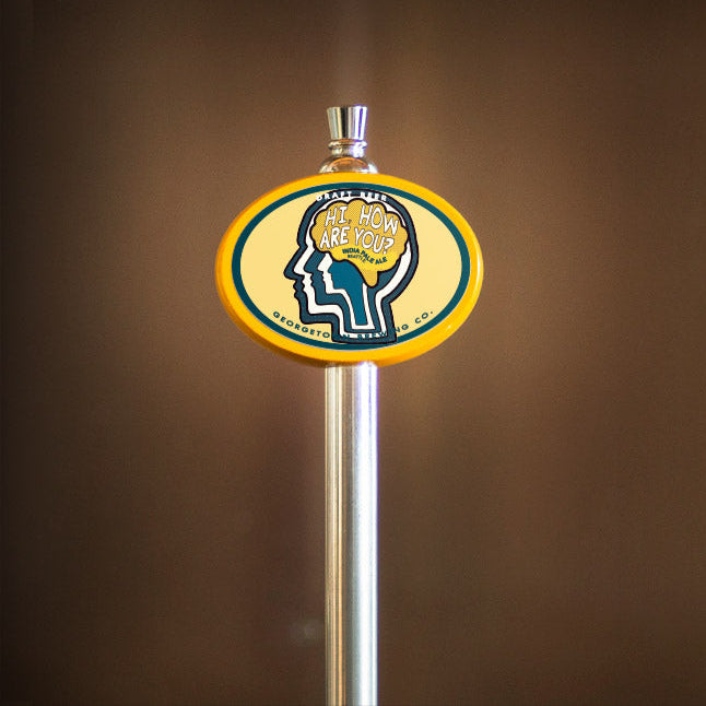 beer tap handle with a brain icon on a brown background
