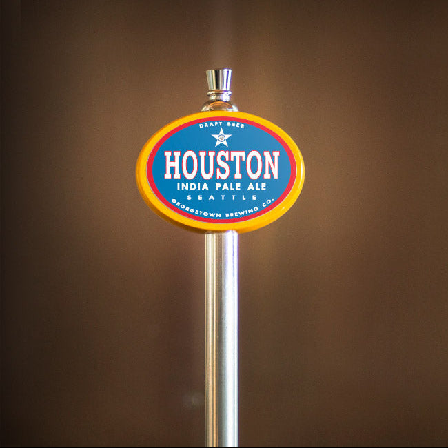 Houston India Pale Ale tap handle against a brown background