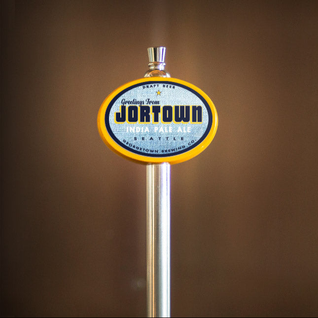 Beer tap handle with 'Jortown' label on a brown background