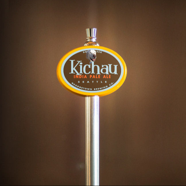 Kichau India Pale Ale tap handle against a brown background