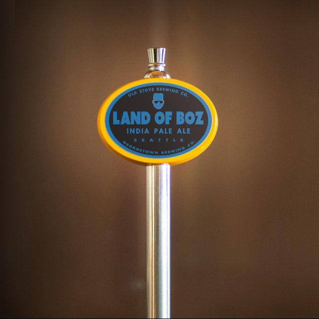 Land of Boz India Pale Ale tap handle against a blurred background