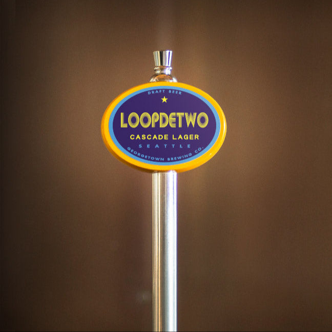 tap handle with LoopdTwo label on a brown background