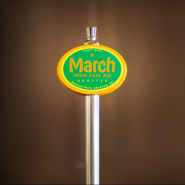March India Pale Ale tap handle against a brown background