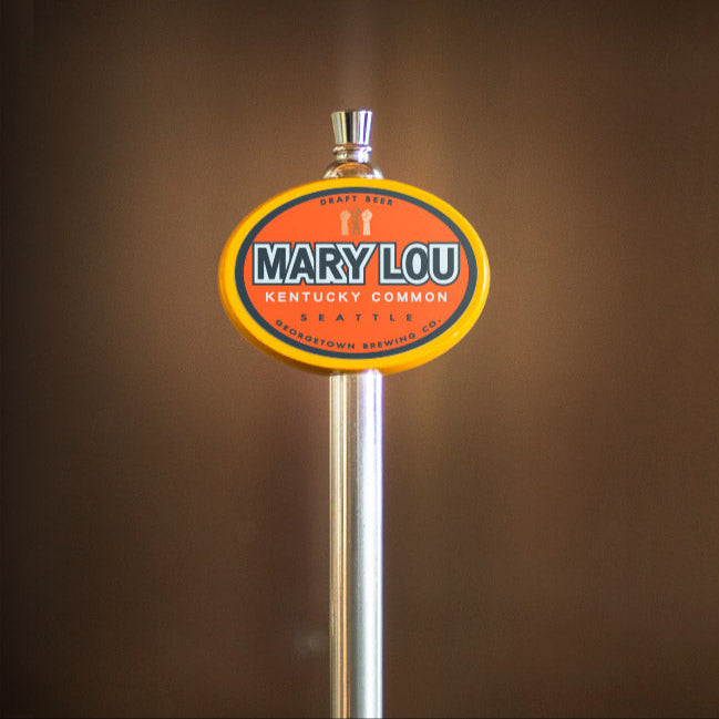 Beer tap handle with 'Mary Lou' branding against a brown background
