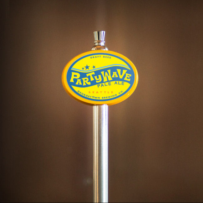 beer tap with a yellow Partywave label on a brown background