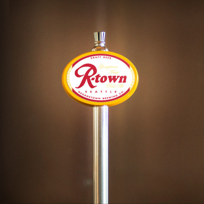 R'town Red Ale logo on a yellow tap handle against a brown background