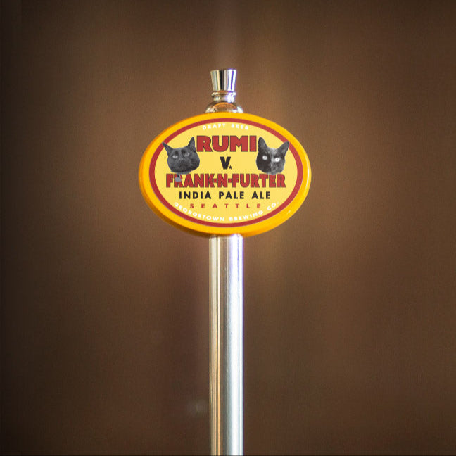 Beer tap handle with 'Rumi v Frankfurter' label on a brown background