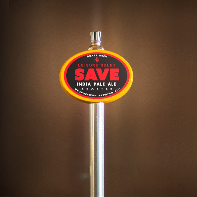 Beer tap handle with 'SAVE' label against a brown background