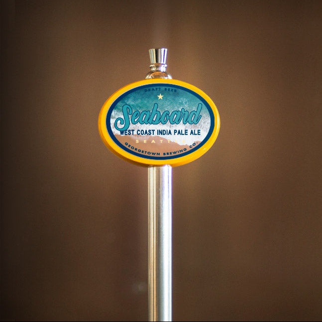 Beer tap handle with Seaboard label on a brown background