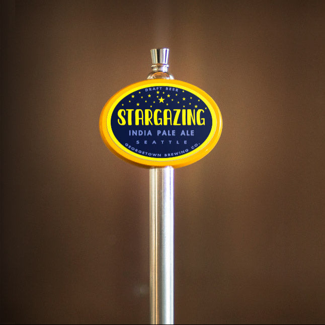 beer tap handle with 'Stargazing' India Pale Ale label on a brown background