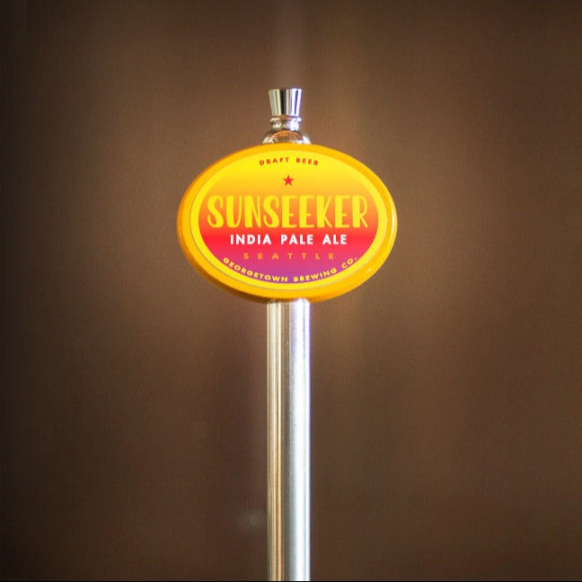 Sunseeker India Pale Ale tap handle against a brown background