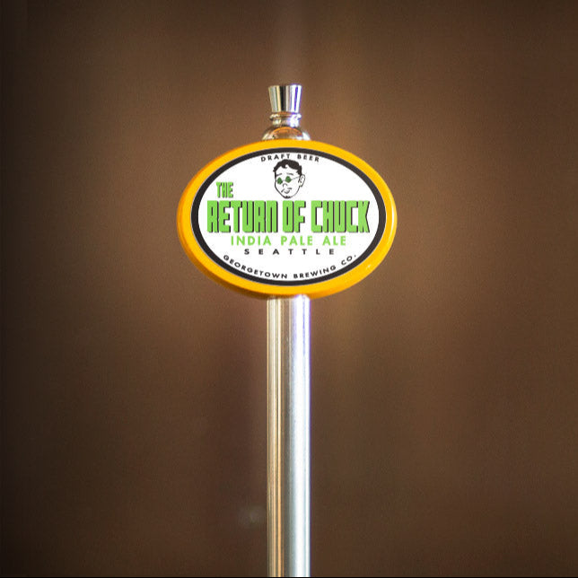 Beer tap handle with The Return of Chuck label on a brown background