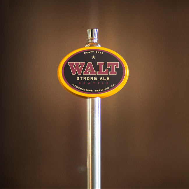 Beer tap handle with 'WALT Strong Ale' label on a brown background