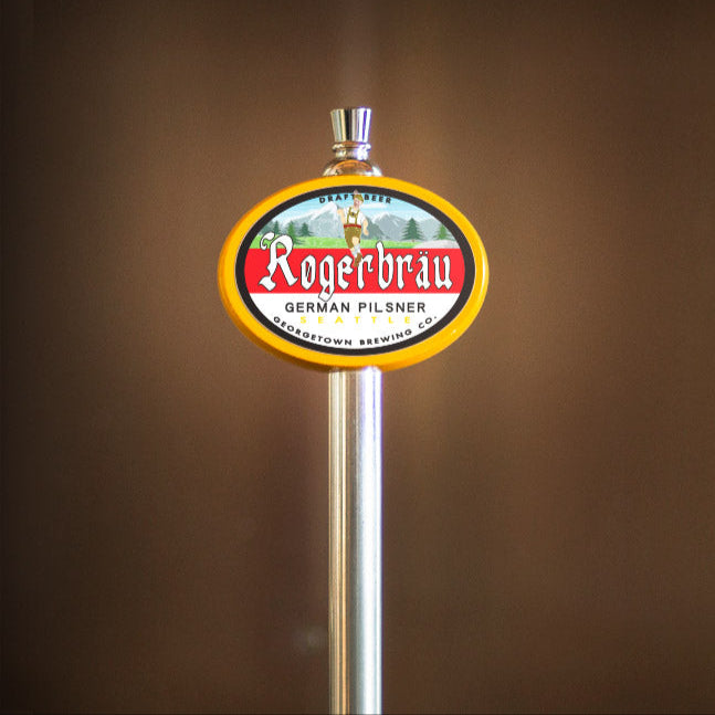 Rogerbrau beer tap handle against a brown background