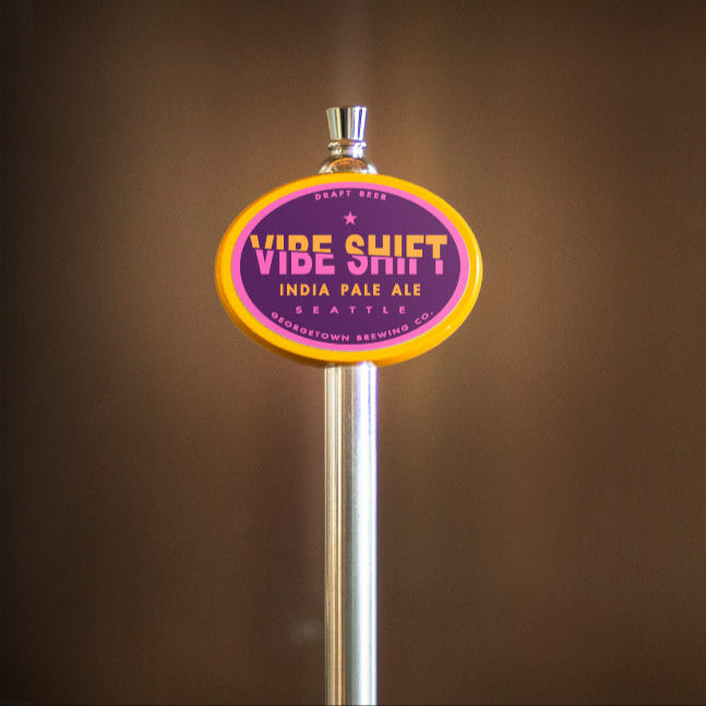 Vibe Shift India Pale Ale tap handle against a brown background