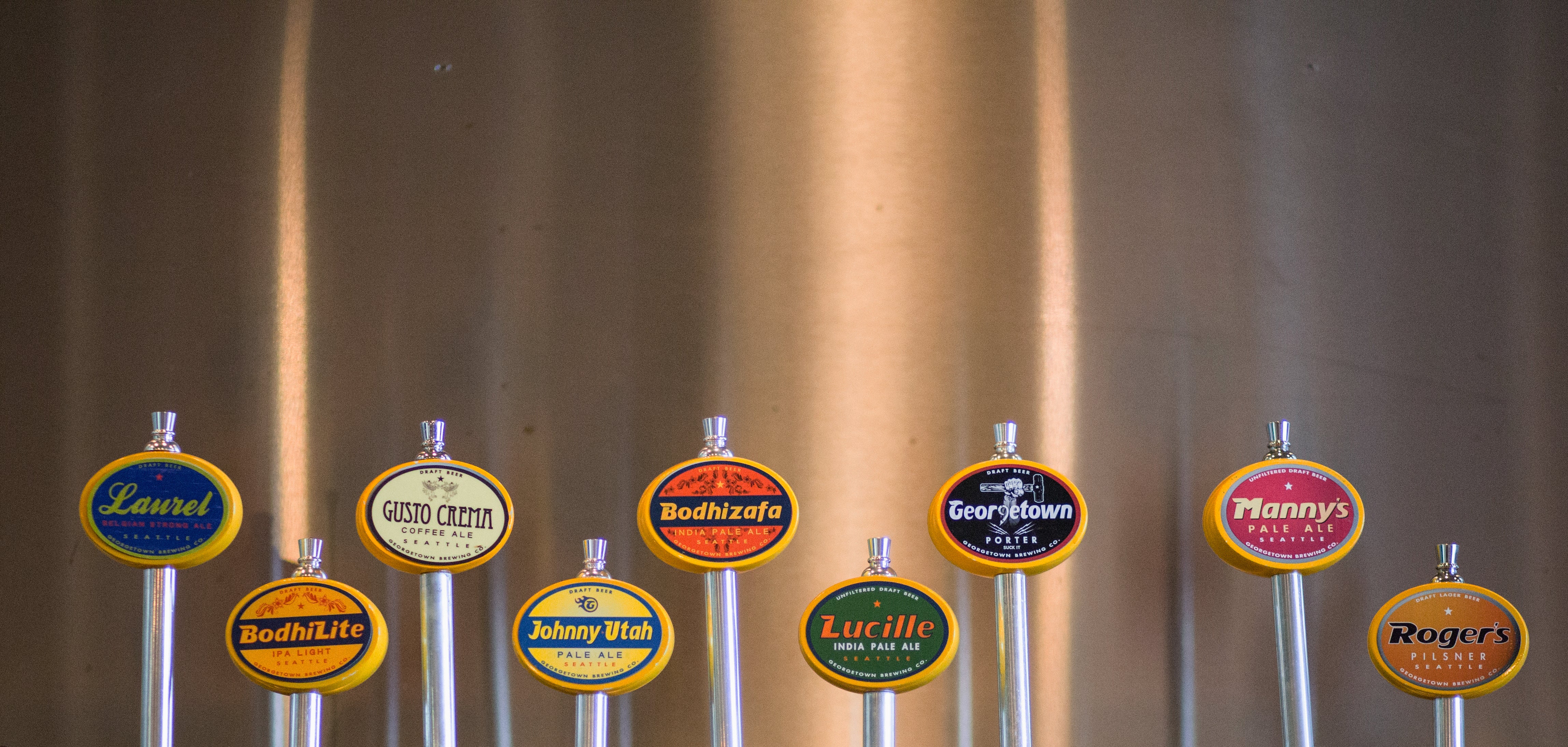 a lineup of georgetown brewing tap handles