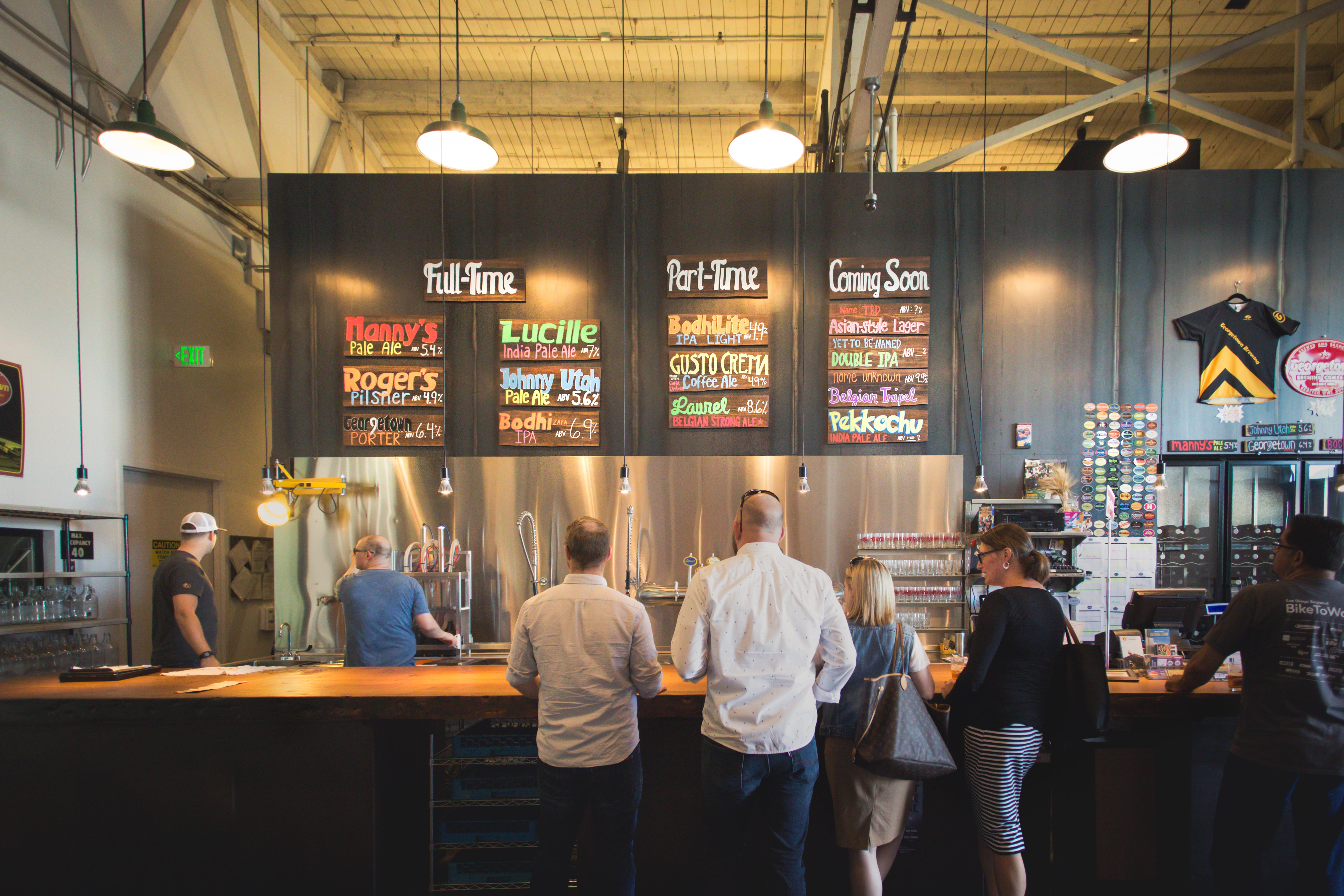 customers lined up at the bar in Georgetown brewery's taproom circa 2015