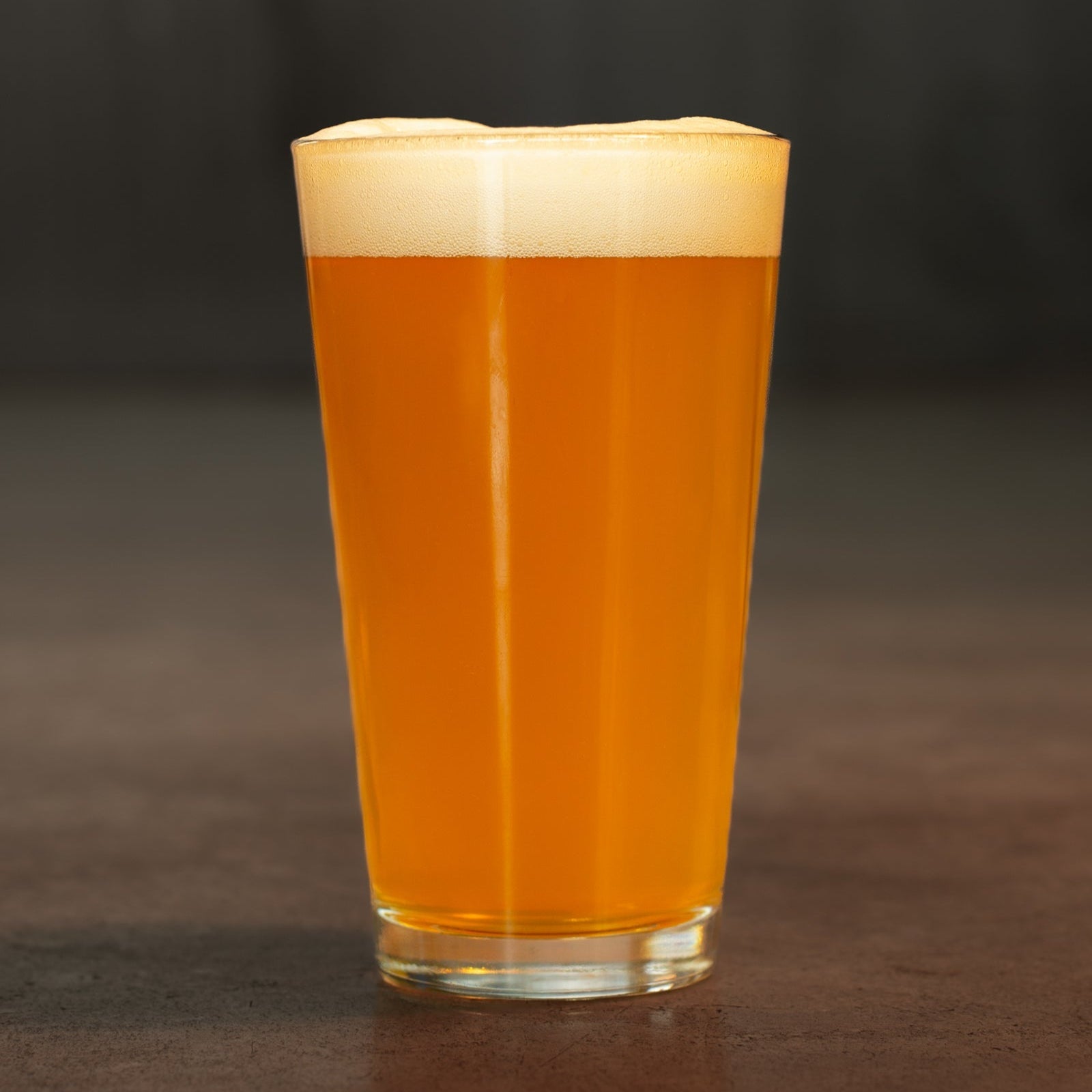 Pint of Johnny Utah pale ale by Georgetown Brewing on the industrial brewery floor 