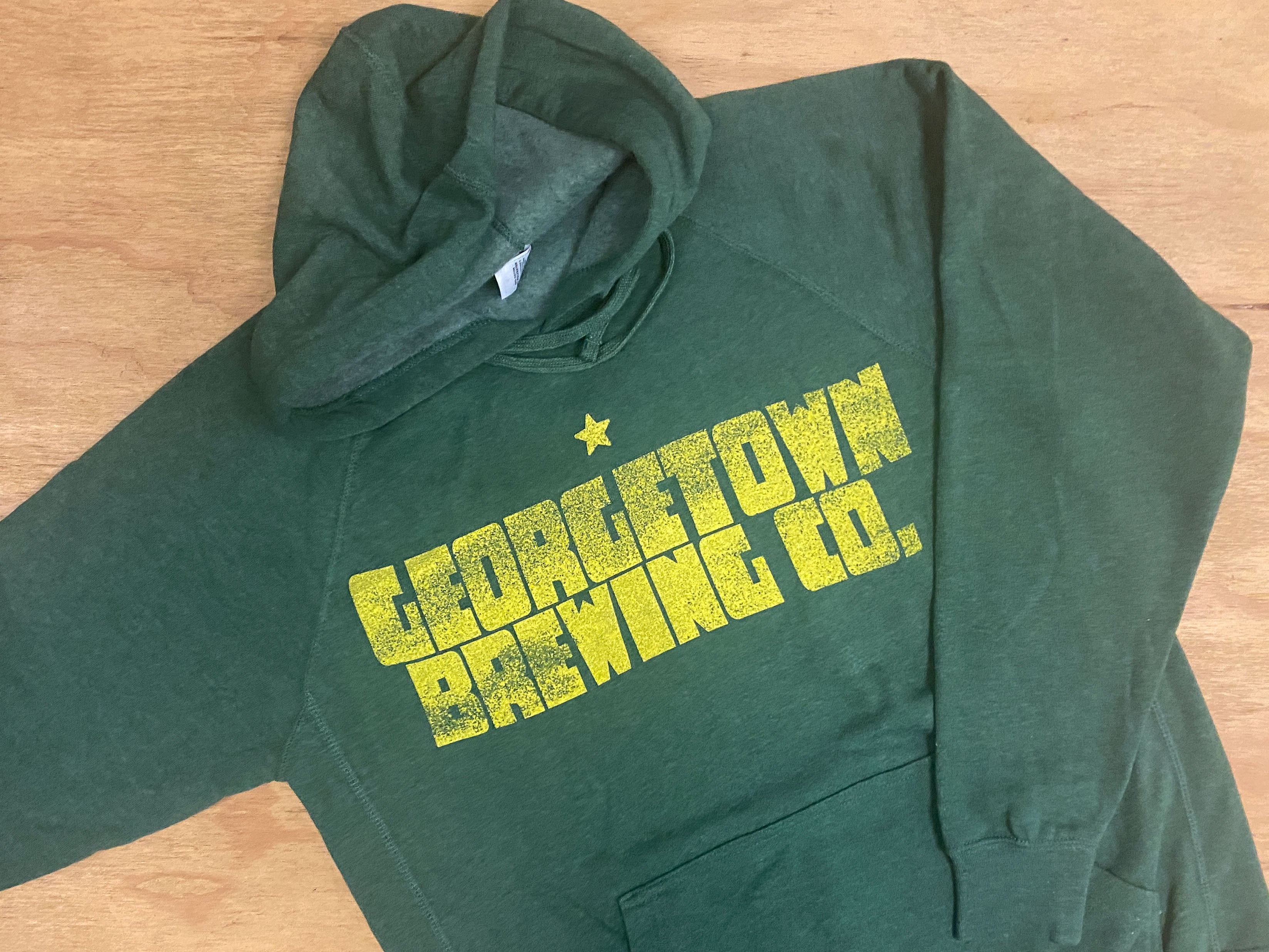 moss green sweatshirtswith yellow text reading georgetown brewing co