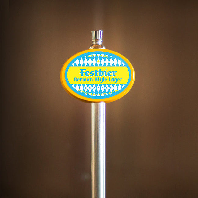 beer tap handle with a colorful blue, white and yellow label that says Festbier German Style Lager