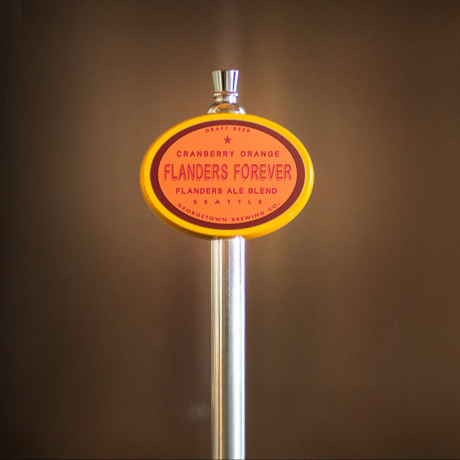 Beer tap handle with 'Flanders Forever' label against a brown background