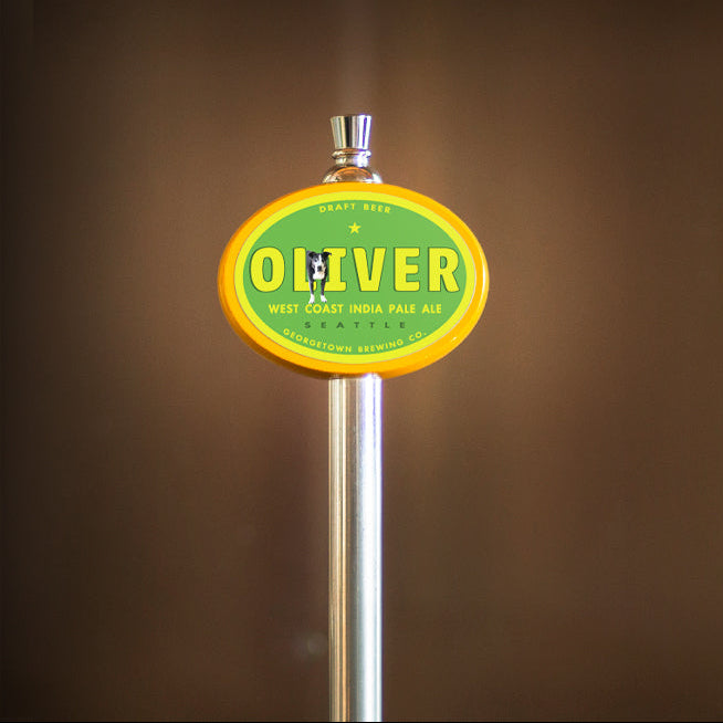 Beer tap with Oliver IPA label featuring a black and white very good boy. 