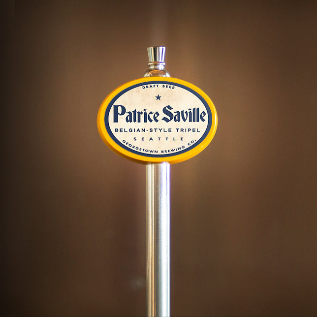Patrice Saville beer tap handle against a brown background