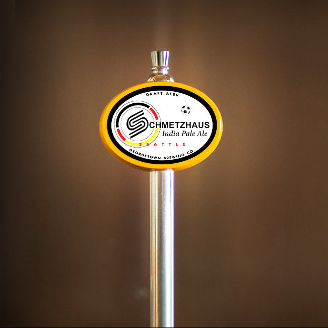 Schmetzhaus IPA tap handle with a logo on a brown background