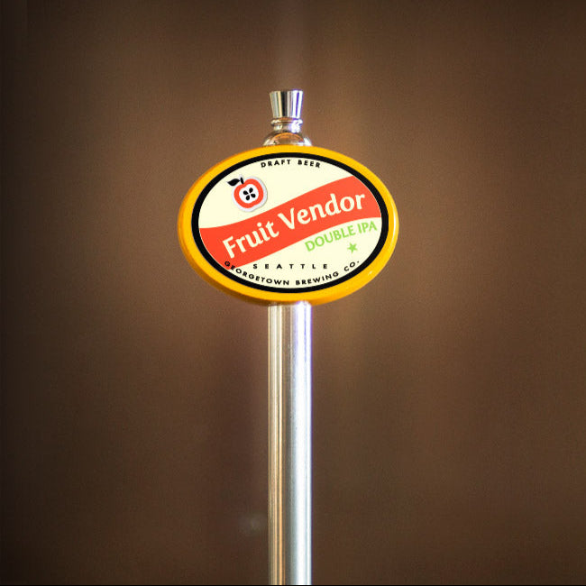 beer tap handle with 'Fruit Vendor' label on a brown background
