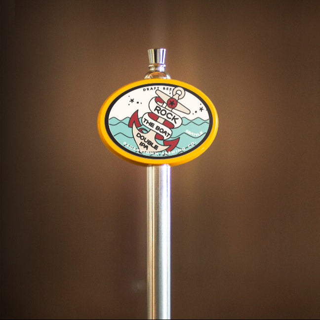 beer tap handle with a colorful Rock the Boat logo on a brown background