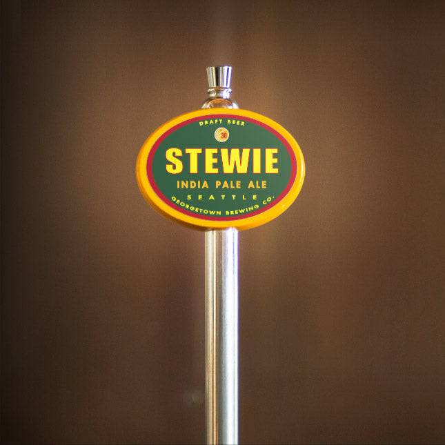 Stewie India Pale Ale tap handle against a brown background
