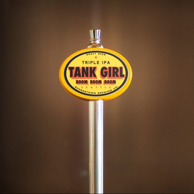 Tank Girl Triple IPA beer tap handle on a brown background