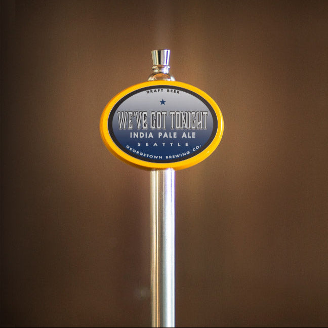 Beer tap handle with 'We've Got Tonight' India Pale Ale label on a blurred background