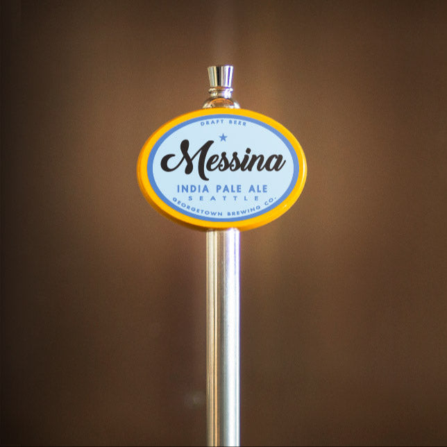 Beer tap with Messina India Pale Ale label against a brown background