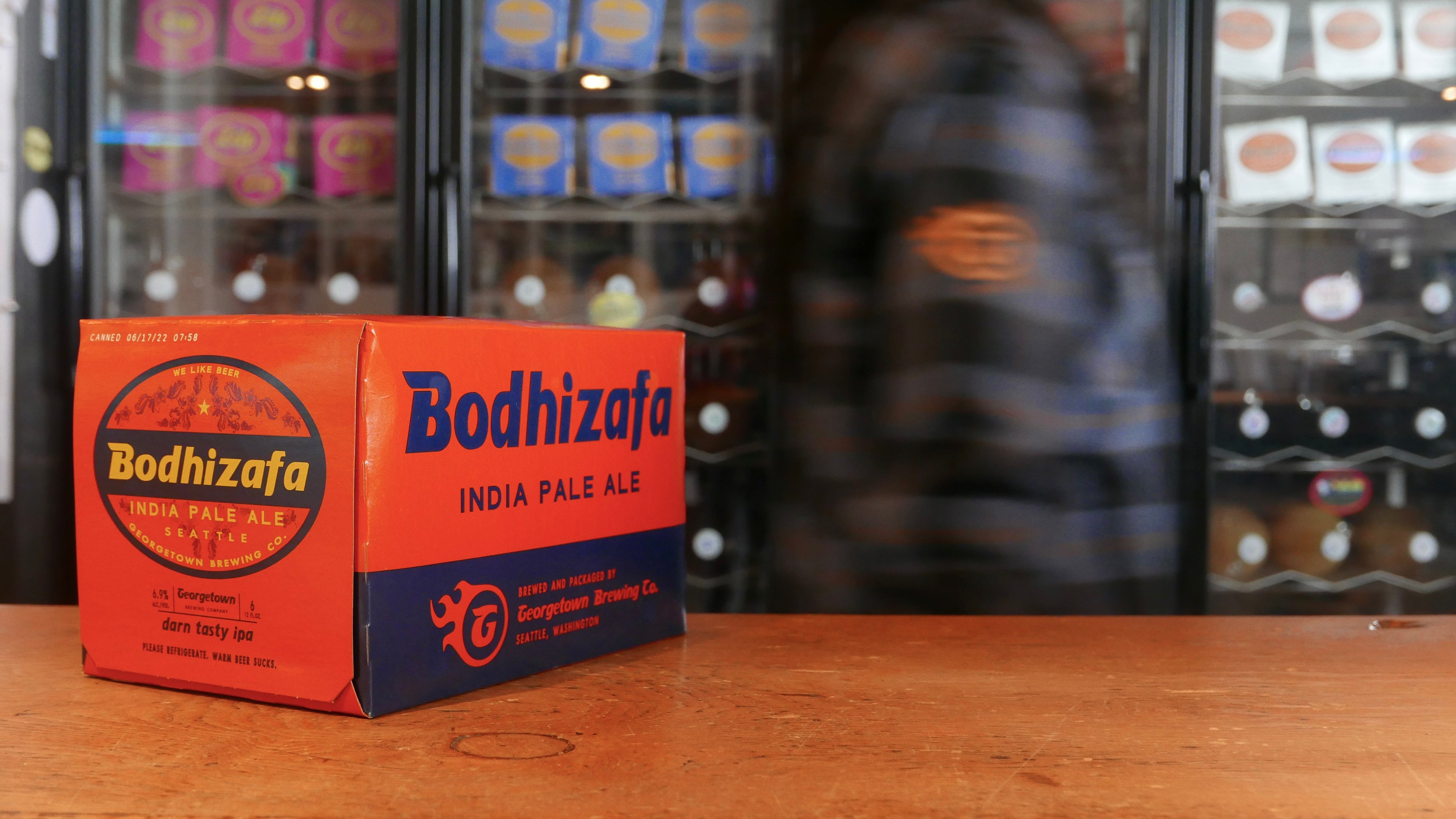a six pack of Bodhizafa on the wooden counter in the taproom
