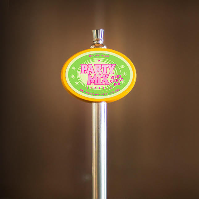 yellow oval tap handle with Party Mix west coast IPA label